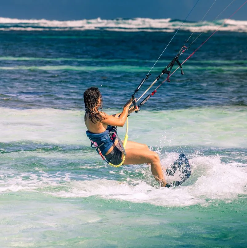A female practicing kitesurfing in the Dominican Republic