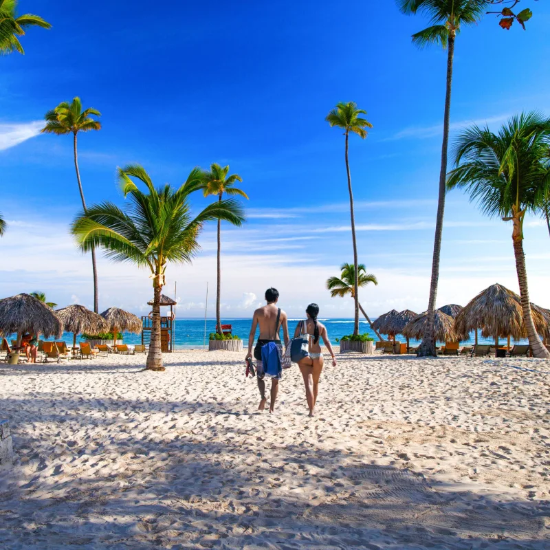 couple walking on dominican republic beach