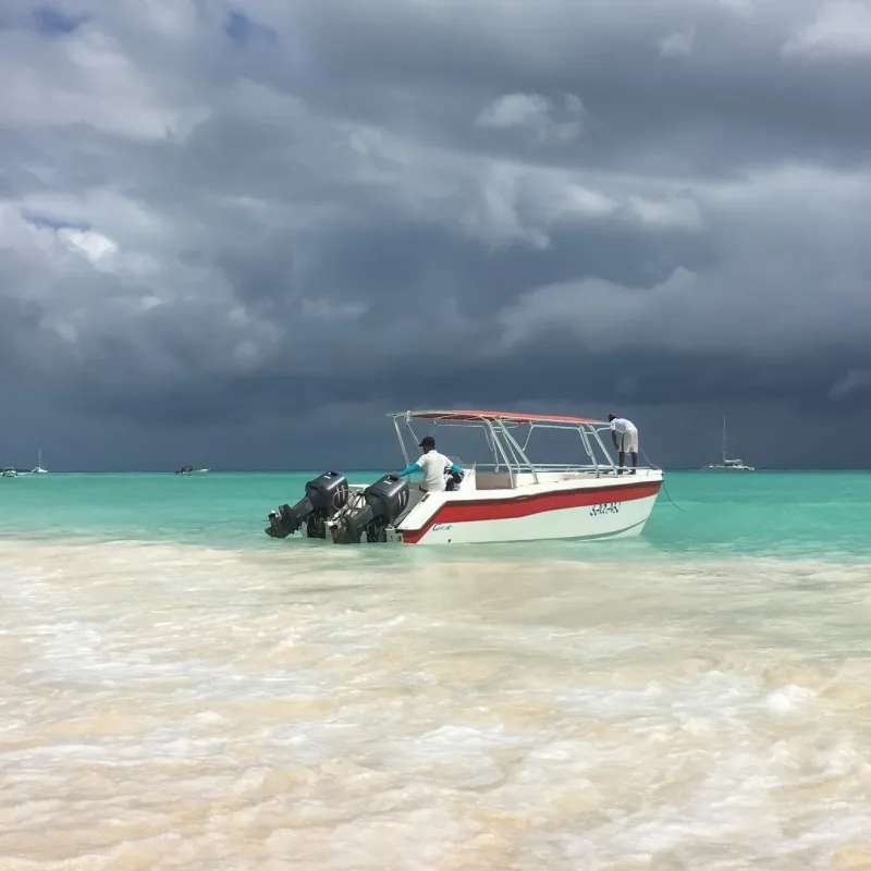 A small fishing boat in the Dominican Republic with stormy weather 