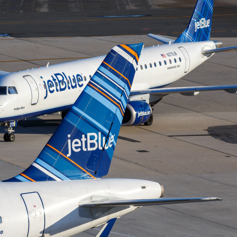 JetBlue planes on tarmac with colourful logos