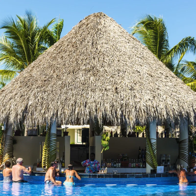 A poolside bar in a resort in the tropics