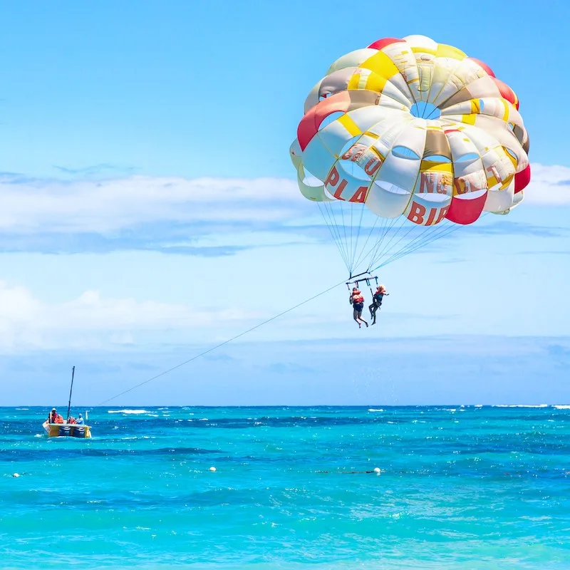 Tourists parasailing on Bavaro Beach in Dominican Republic