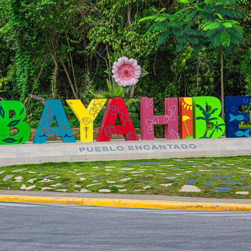 A colourful Bayahibe sign with lush vegetation 