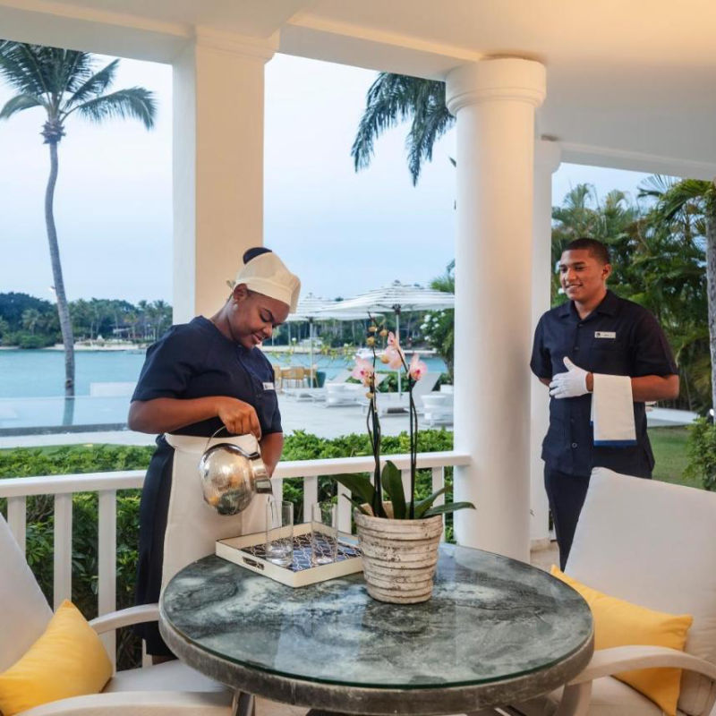 Casa de Campo staff assisting in room with Caribbean view