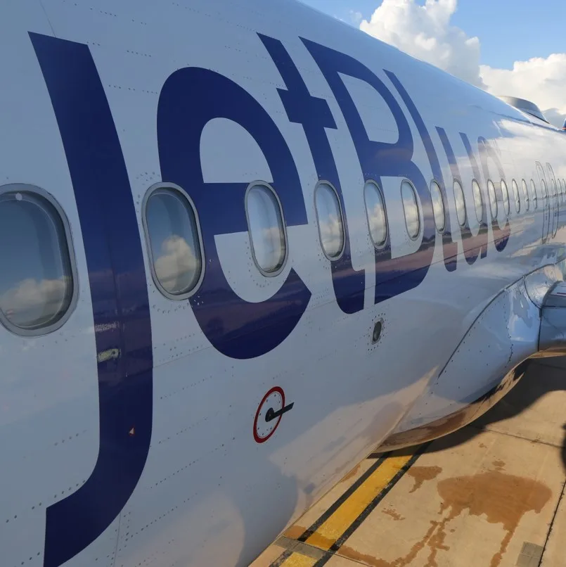 JetBlue logo on plane fuselage