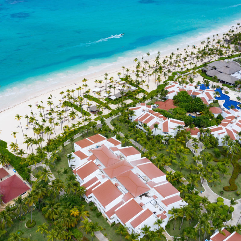 Aerial shot of a Punta Cana resort with tropical water and greenery