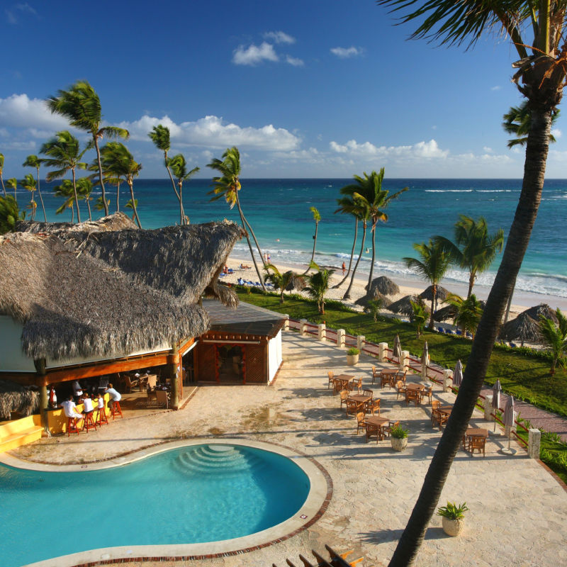 Resort area in Punta Cana with pool and palm trees