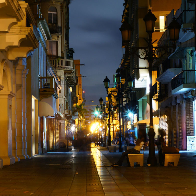 Santo Domingo busy night streets with lights and shops