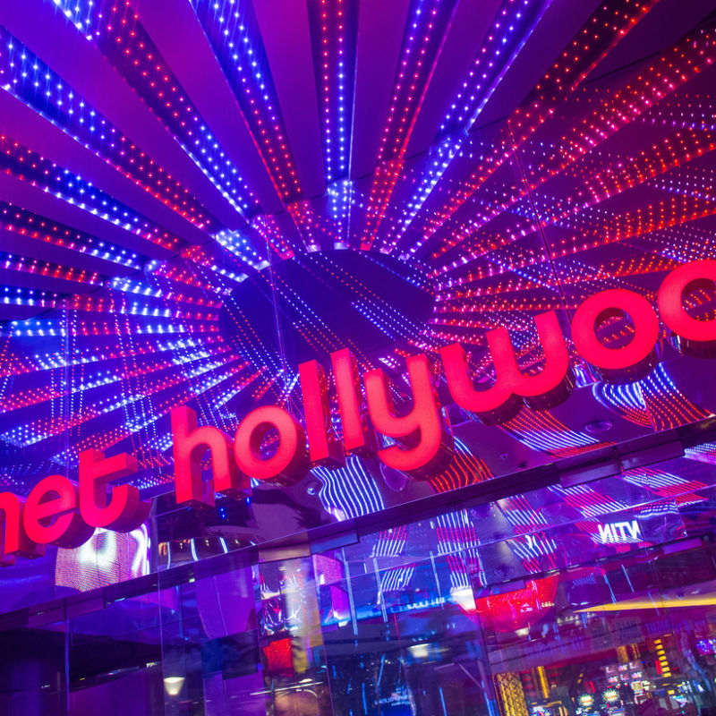 Colourful Planet Hollywood neon sign 
