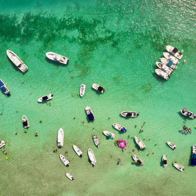 Small boats in the tropical sea in the Caribbean with clear water 