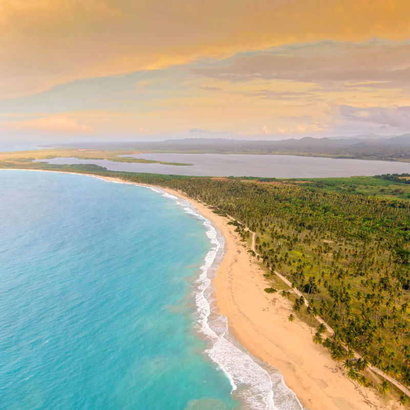 A long stretch of coastline in the Dominican Republic with rainforest 