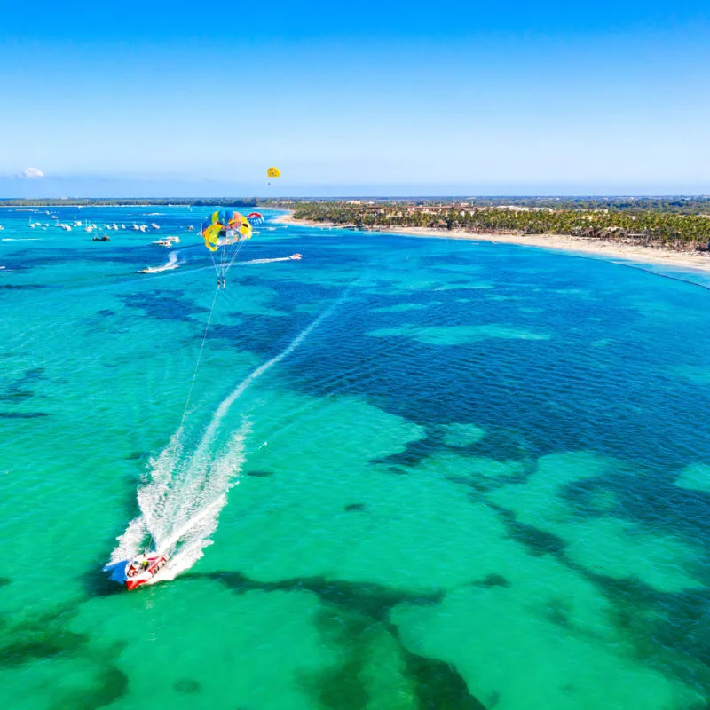 aerial view of a boat in Punta Cana sailing on top on blue waters 