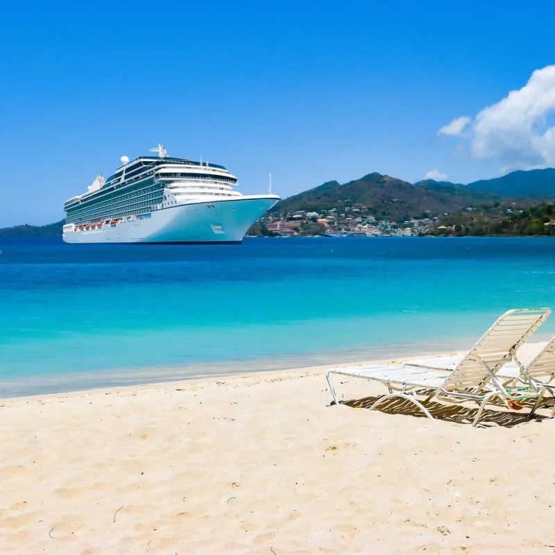 Colourful tropical water and a cruise ship floating on it