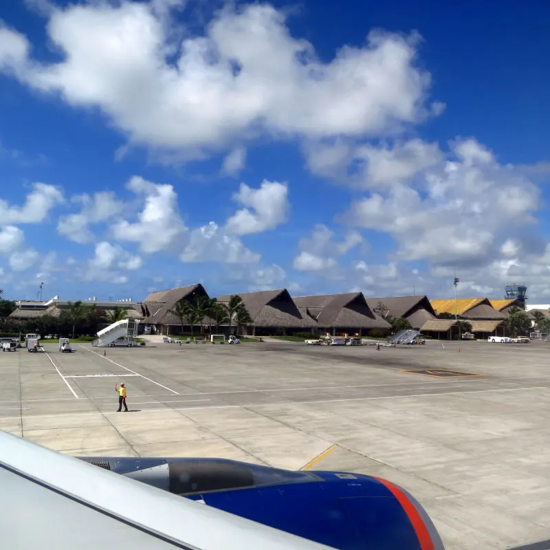 Outside view of Punta Cana airport terminal with aircraft 