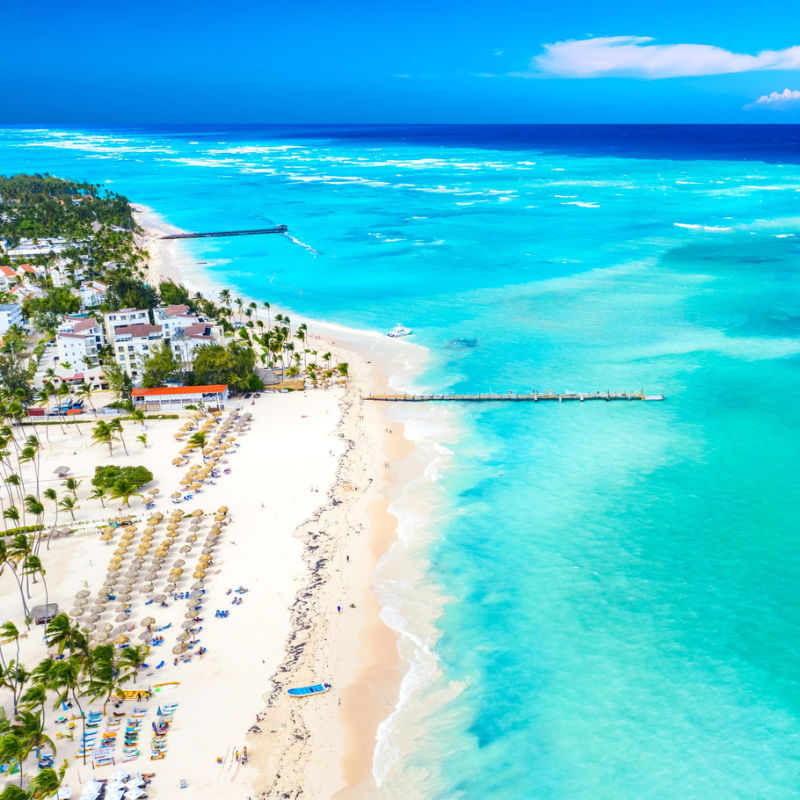 Aerial picture of a Punta Cana resort area with blue tropical water