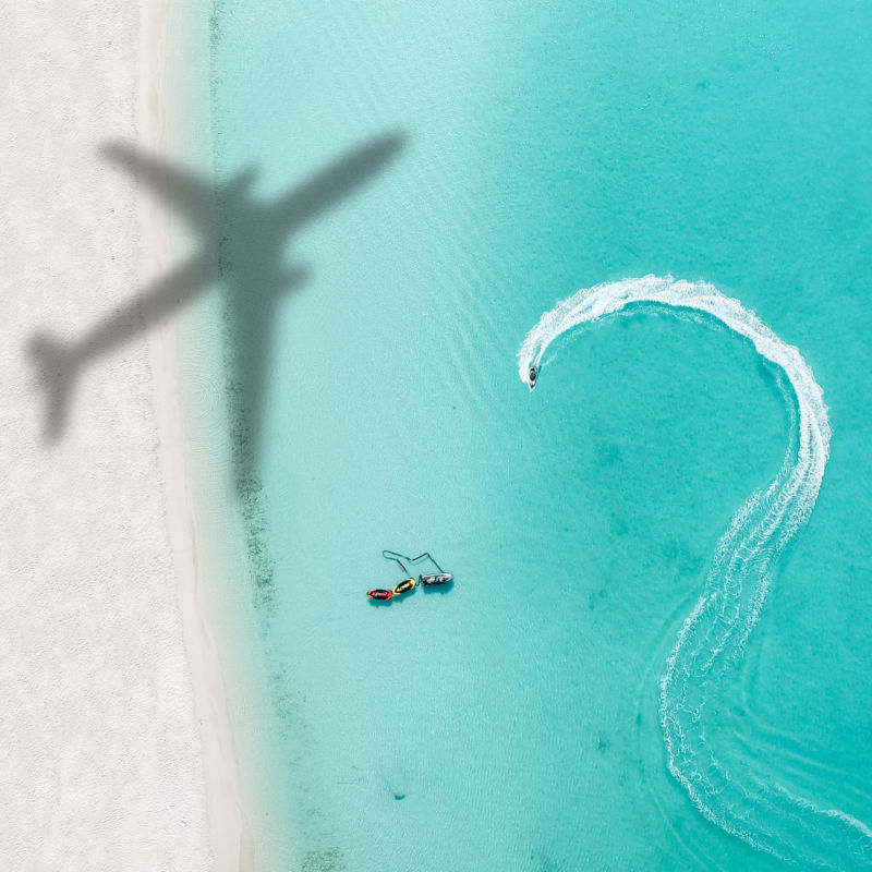 Drone view of the Airplane shadow flying over a beach at the Dominican Republic