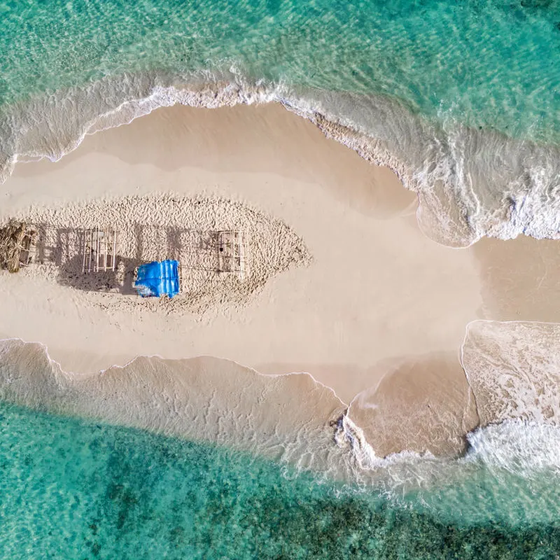 Bird's eye view of Cayo Arena with blue water and sand bank