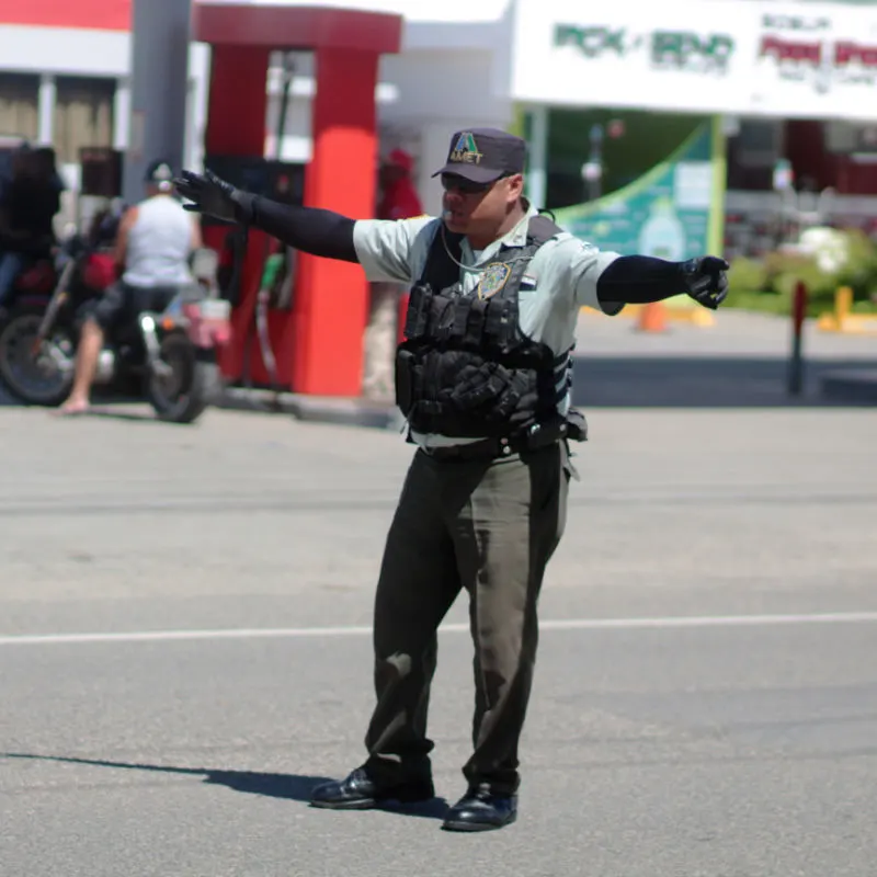 Dominican Republic Policeman maintaining the traffic order at a special occasion.