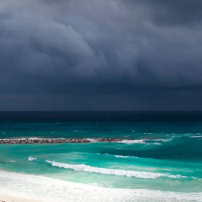 Dark clouds at sea viewed from the beach