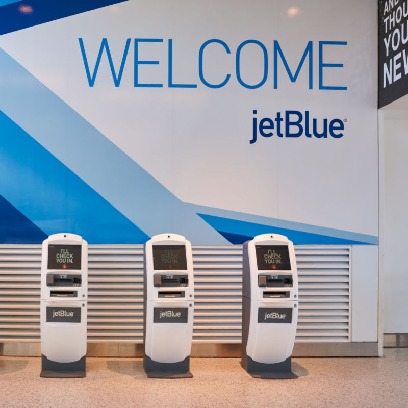 Welcome JetBlue Sign and self transfer service computers. 