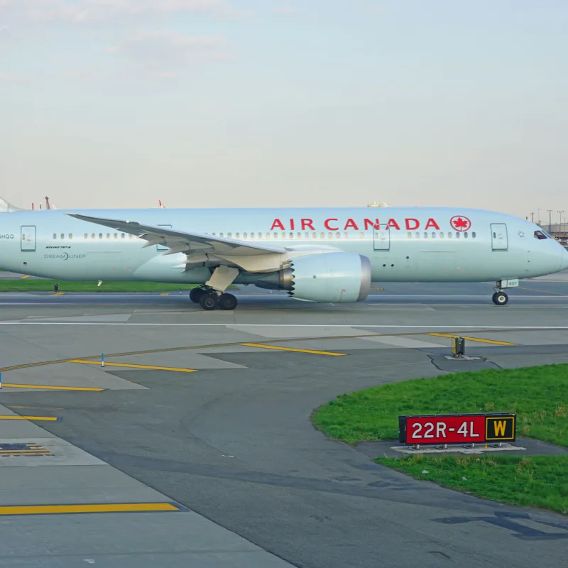 Air Canada plane taxiing at an airport 
