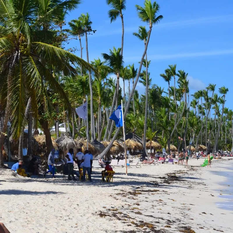 Relaxed travelers and locals on a Punta Cana beach