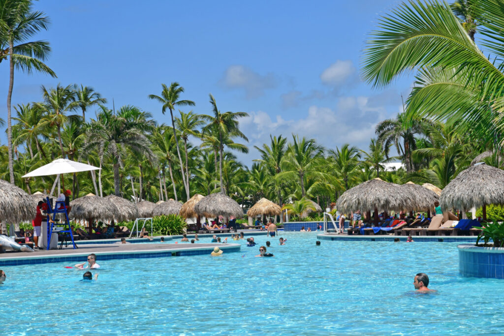 A family friendly resort in Punta Cana with people swimming 