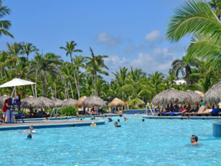 A family friendly resort in Punta Cana with people swimming