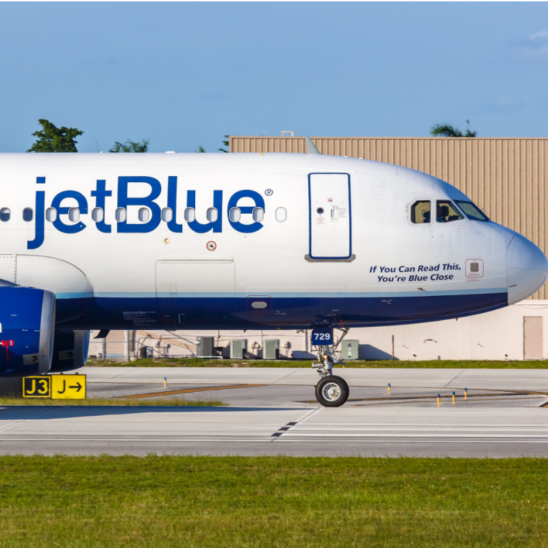 A JetBlue aircraft parked on a terminal in the Dominican Republic 