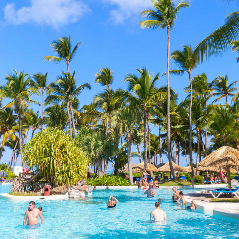 A pool with travelers in the Dominican Republic
