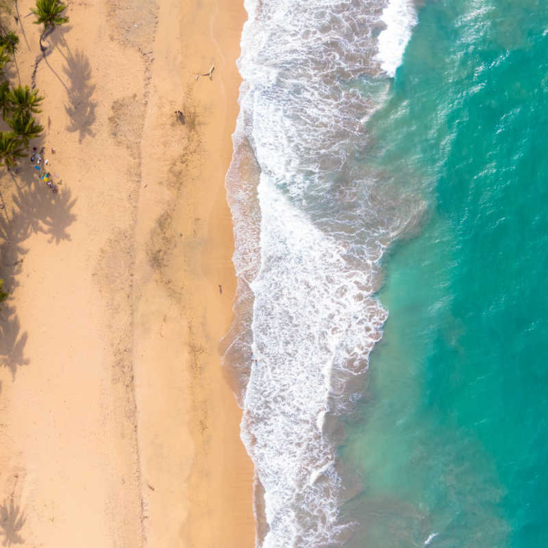 aerial view of a white sand beach in miches