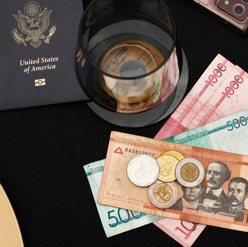 A US passport beside dominican pesos