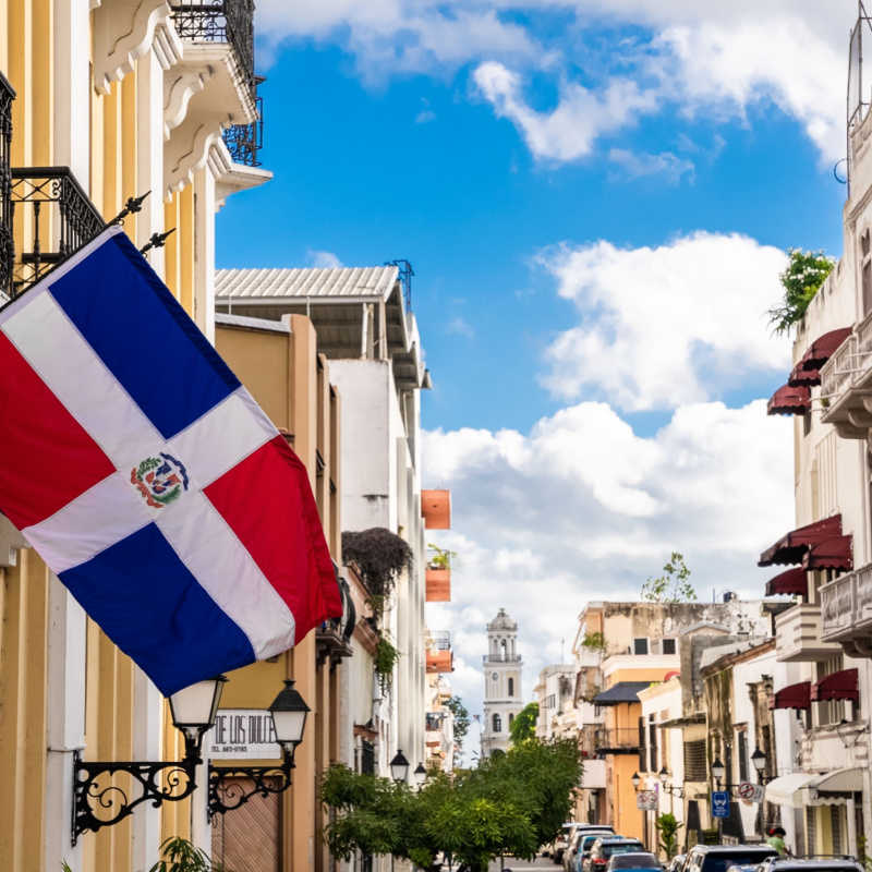 view of santo domingo old town street with flag 
