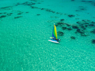 a sailboat in Punta Cana amid turquoise water