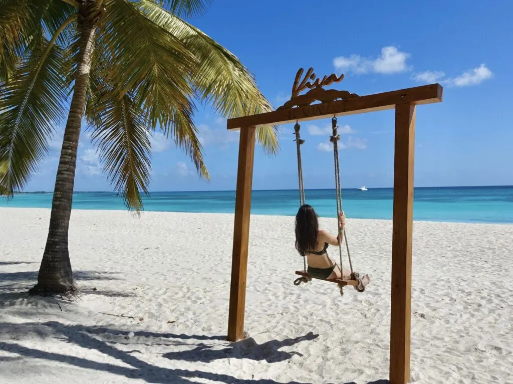 Woman on swings solo in DR beach Bavaro